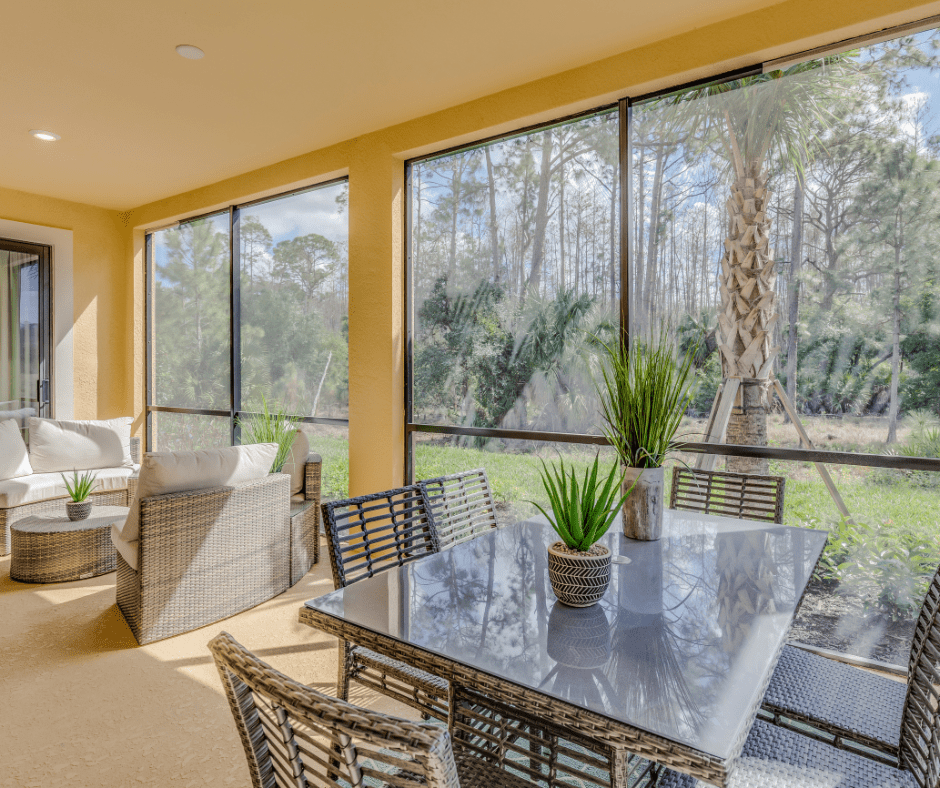 sunroom with a warm and sunny feel with nice patio furniture and large windows